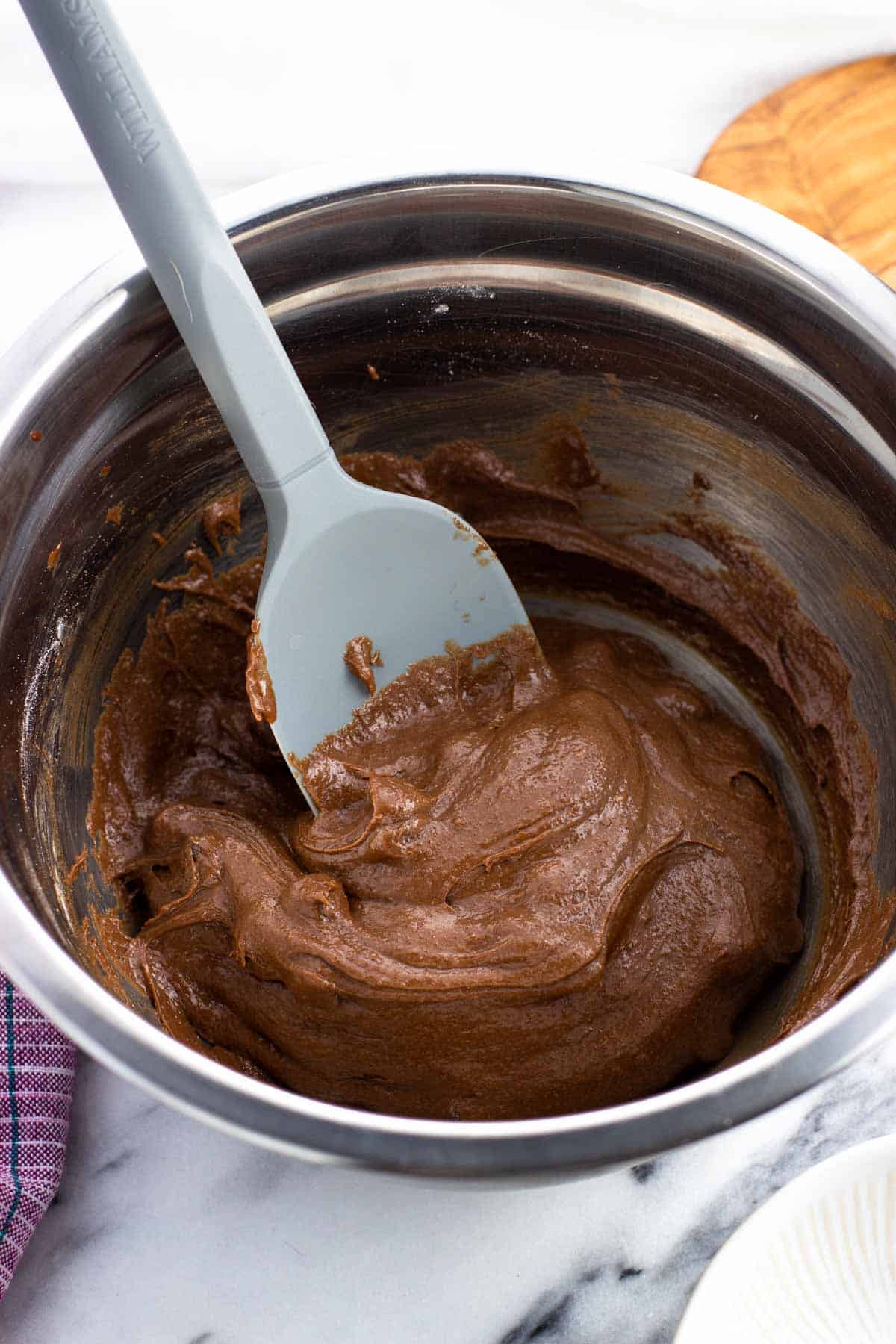 Chocolate chips stirred into the brownie batter.