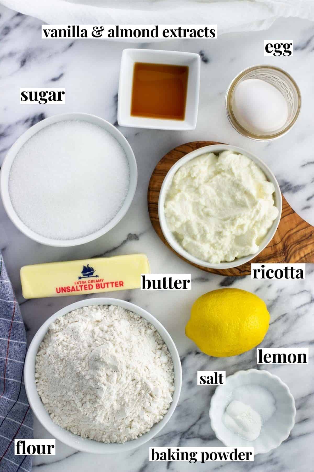 Labeled cookie ingredients on a marble board.