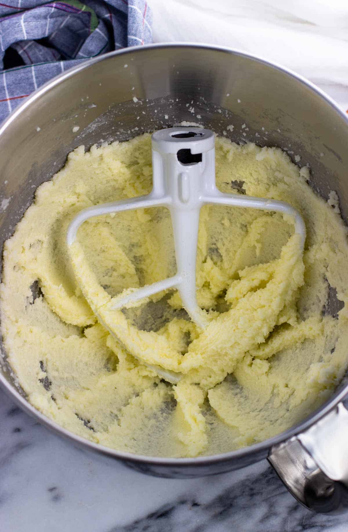 Creamed butter and sugar in a stand mixer bowl with the paddle attachment.