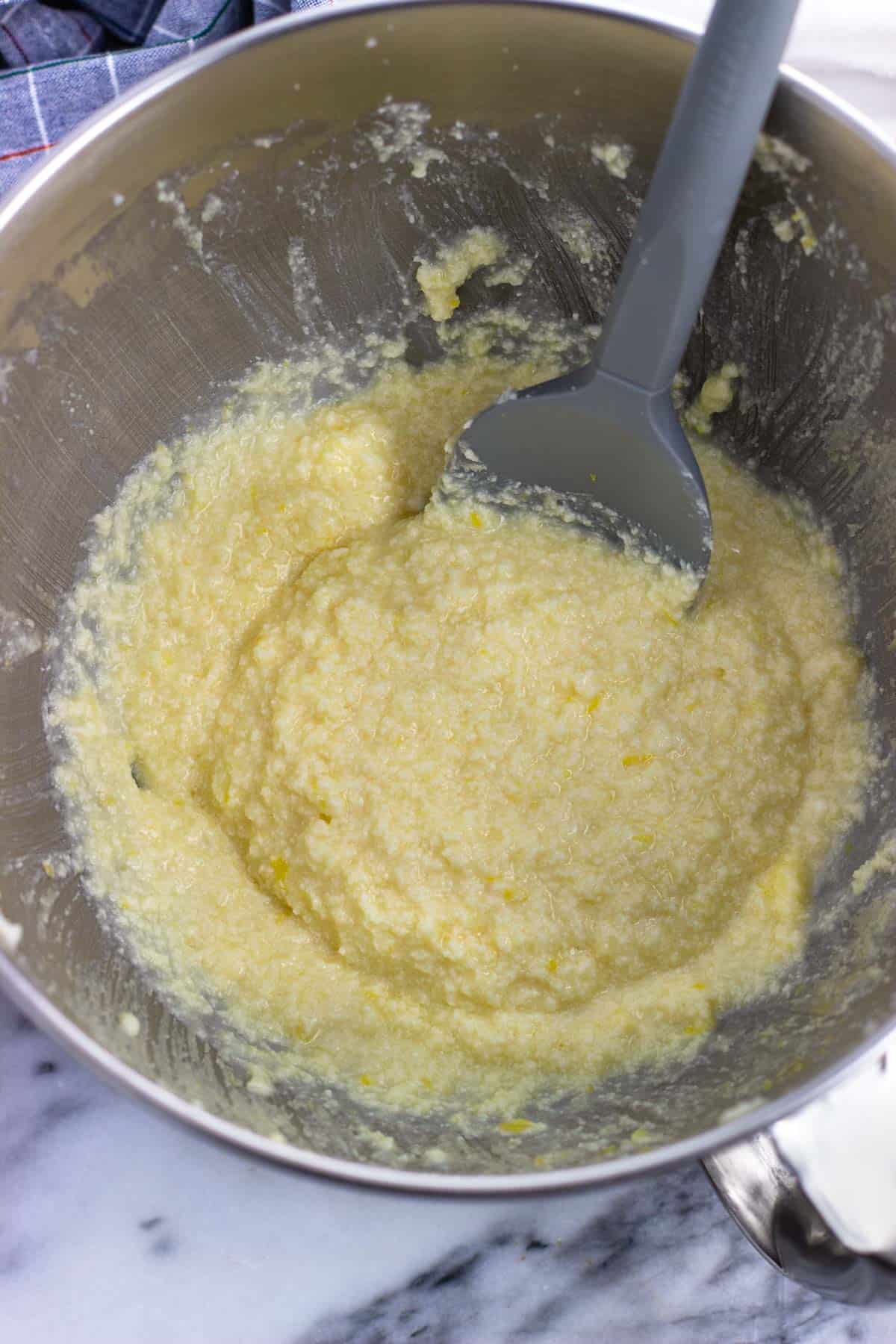 All wet ingredients, including ricotta, mixed together in a bowl.