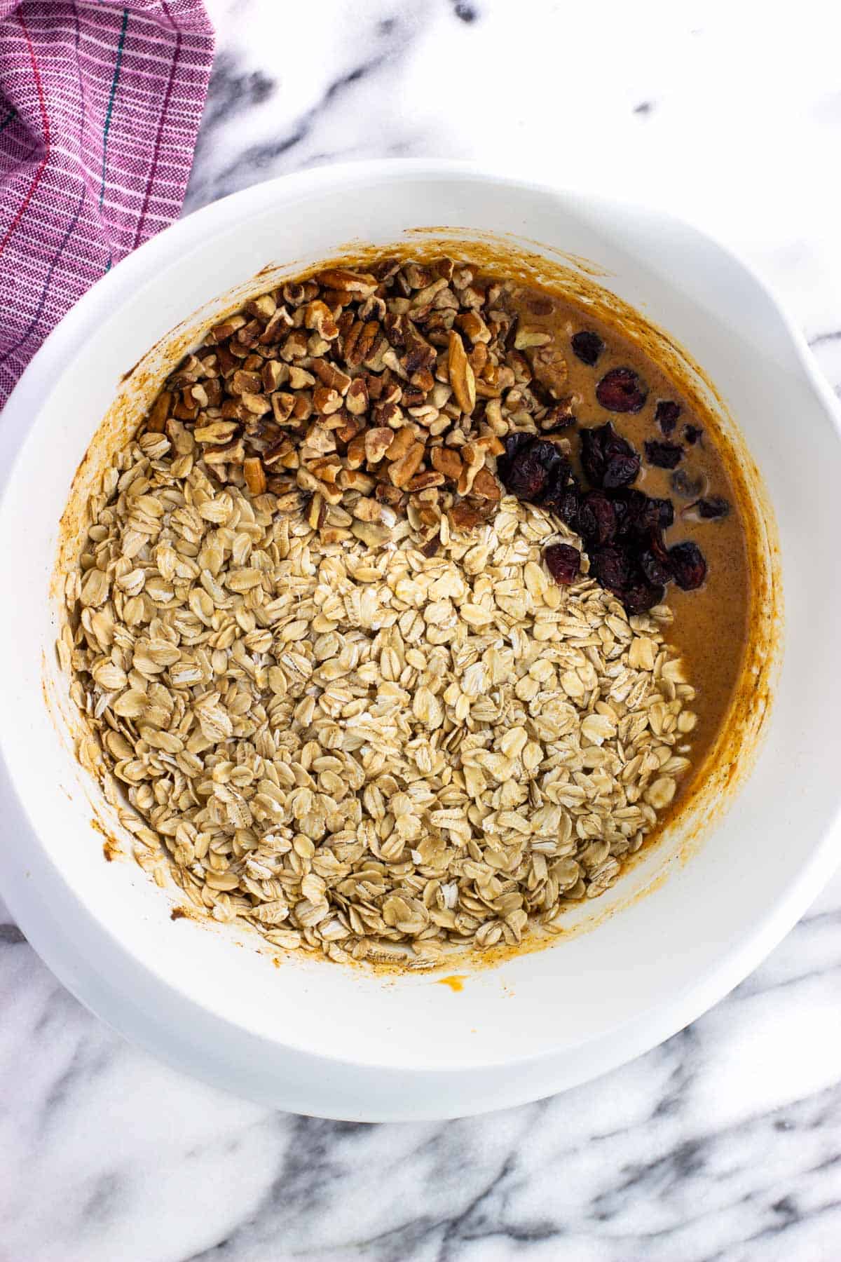 Oats, nuts, and dried fruit added to the pumpkin baked oatmeal mixture.