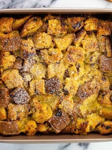 Baked panettone french toast in a square pan.