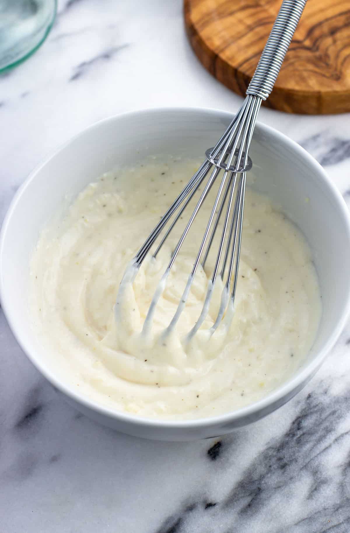 Horseradish aioli whisked together in a bowl.