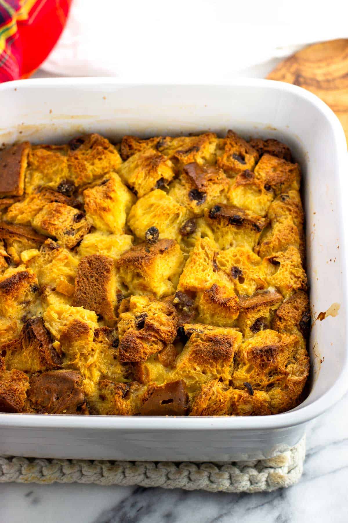 The baked panettone bread pudding in the baking dish.