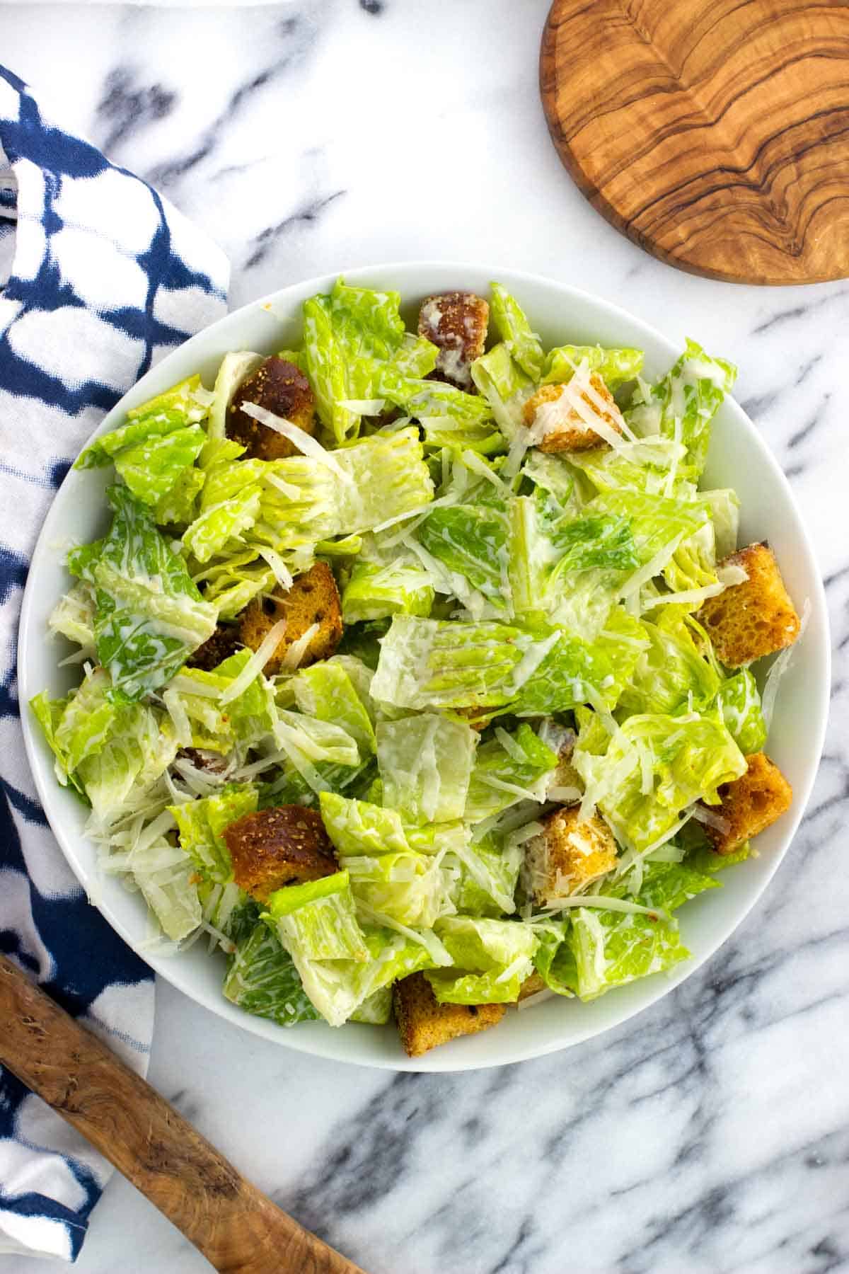 A bowl of greek yogurt caesar salad.