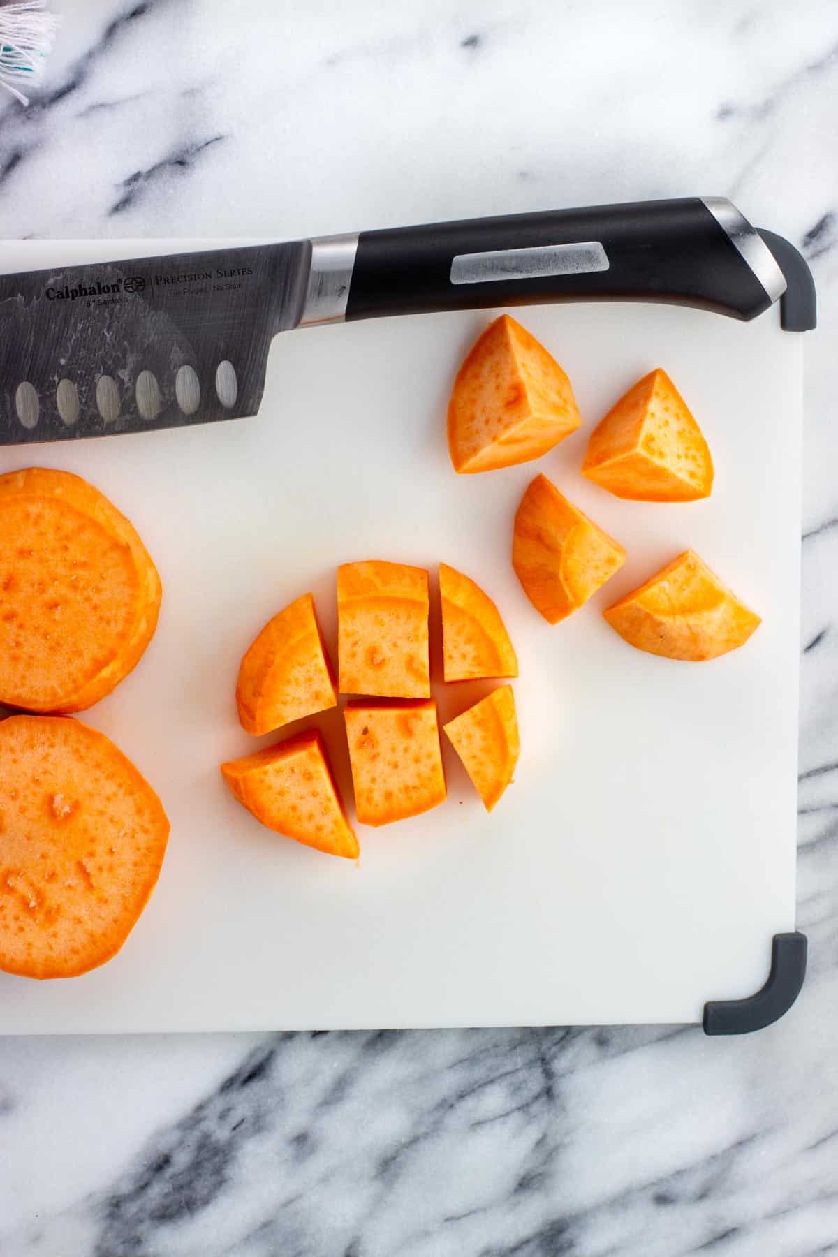 A sweet potato section cut into one-inch chunks.