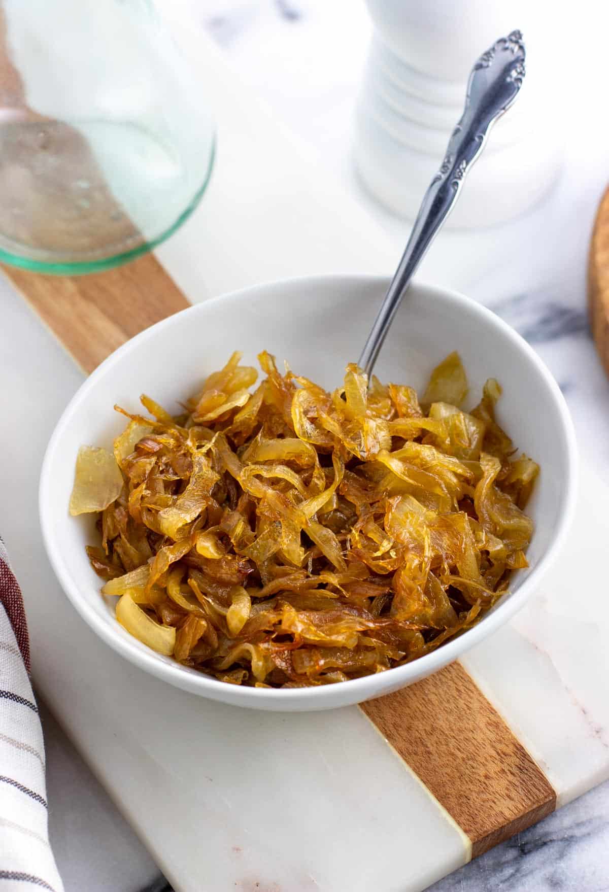 A small ceramic bowl of caramelized onions.