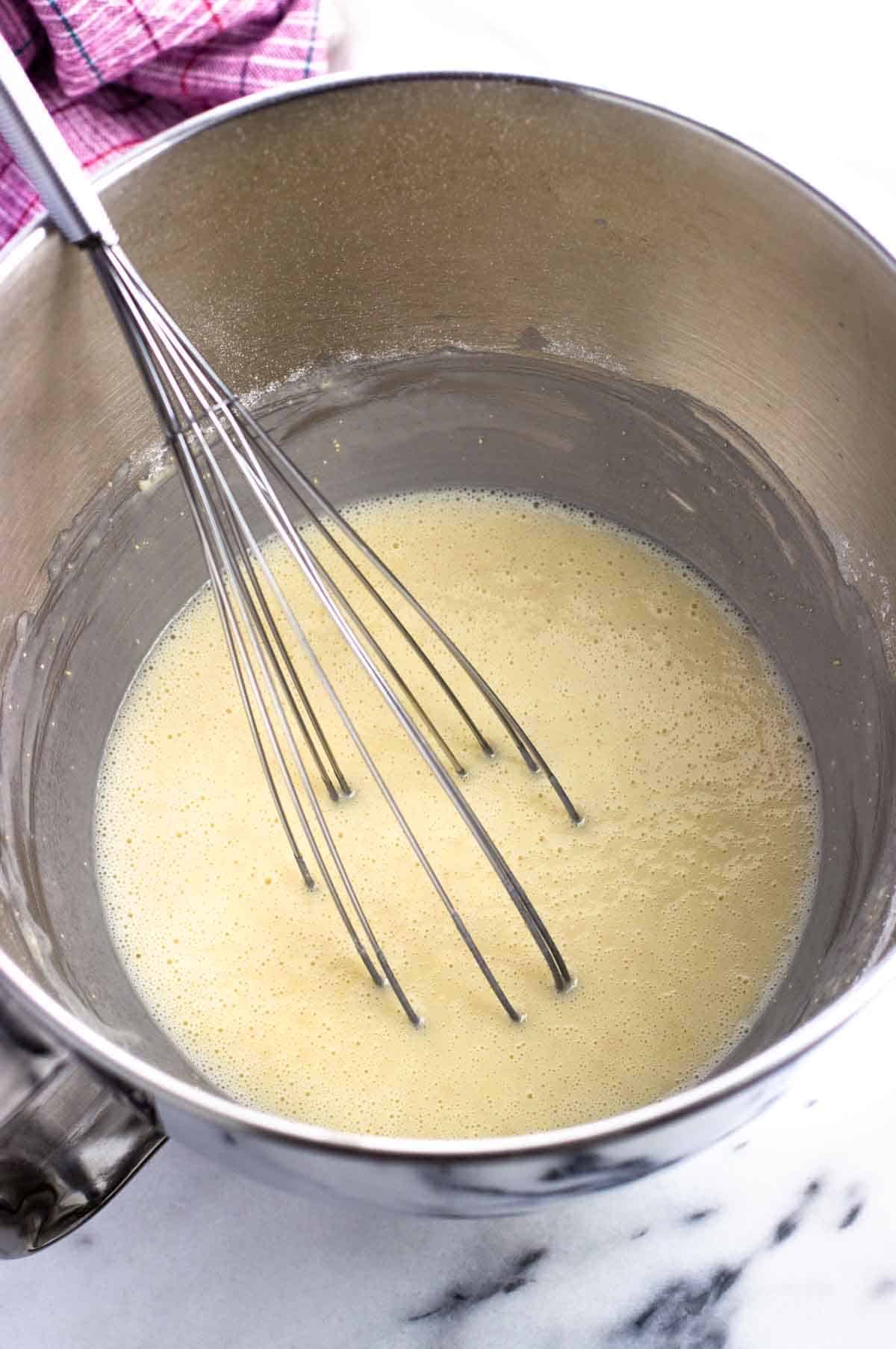 Warm milk/butter whisked into the dry ingredients.