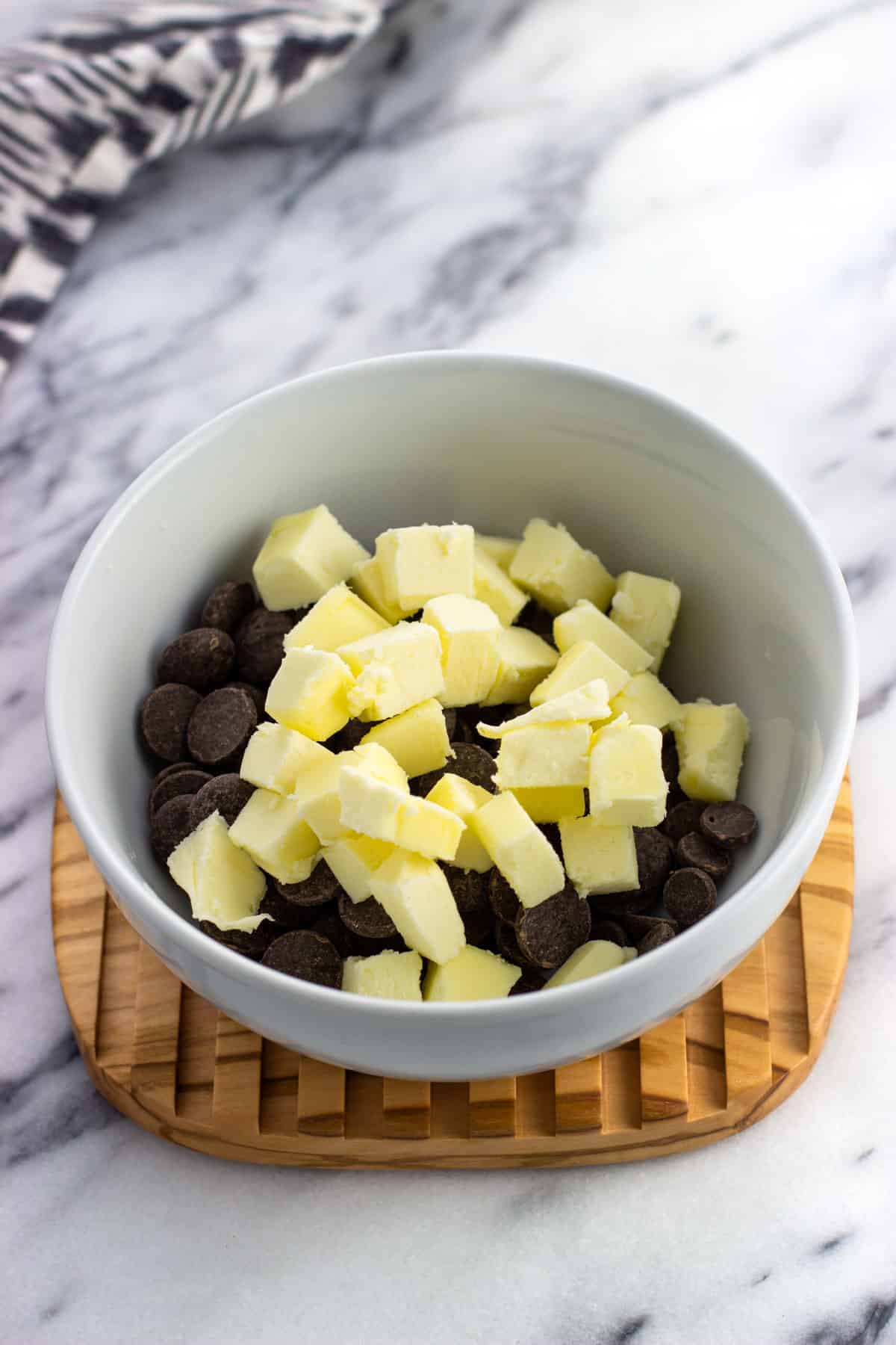 Cubed butter and chocolate chips in a bowl.