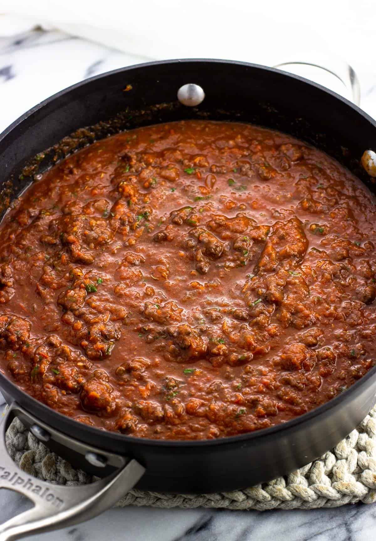 Bolognese sauce in the pan before thickening.