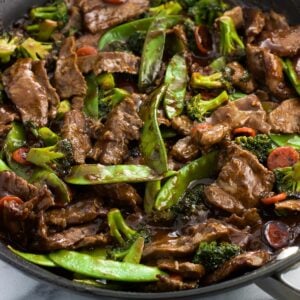 Peanut beef stir fry in a skillet.