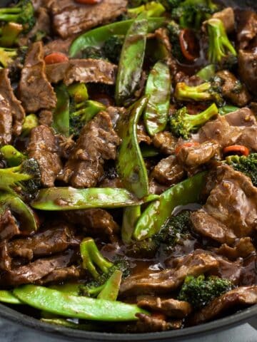 Peanut beef stir fry in a skillet.