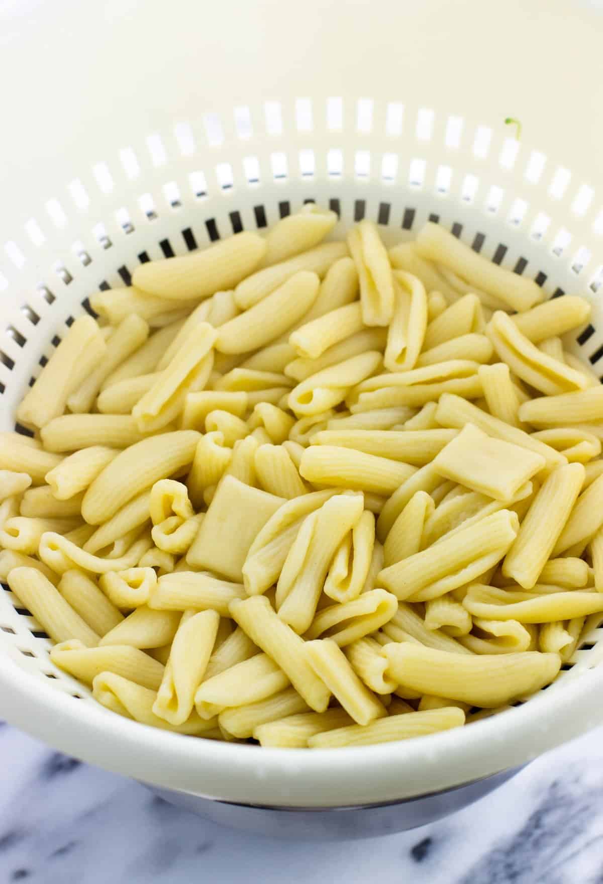 Drained cavatelli in a colander.