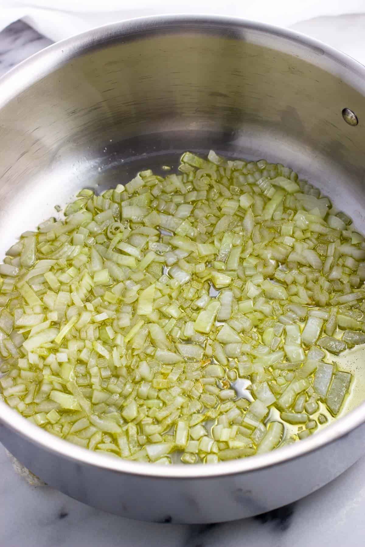 Sauteed onion and garlic in olive oil in a pan.