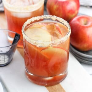 Cranberry apple margaritas on a serving board.
