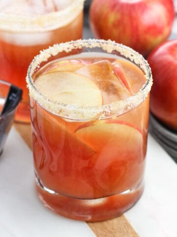 Cranberry apple margaritas on a serving board.