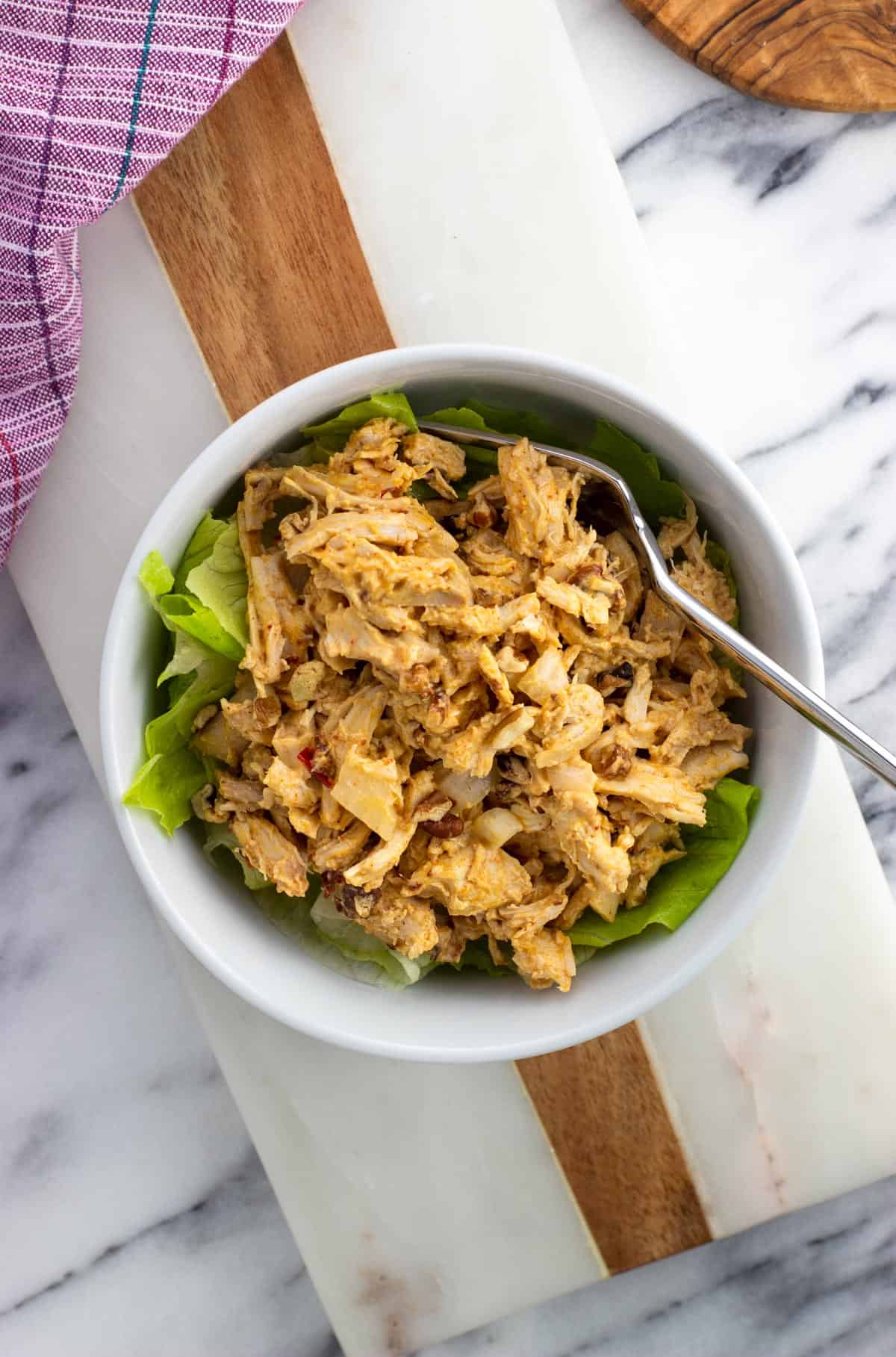 Chicken salad in a bowl made with chipotle aioli.