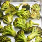 Roasted broccoli on a sheet pan.