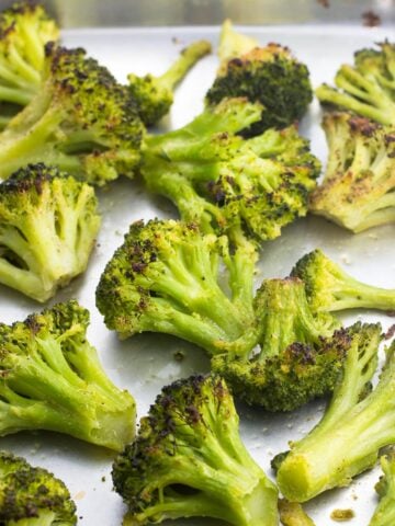 Roasted broccoli on a sheet pan.