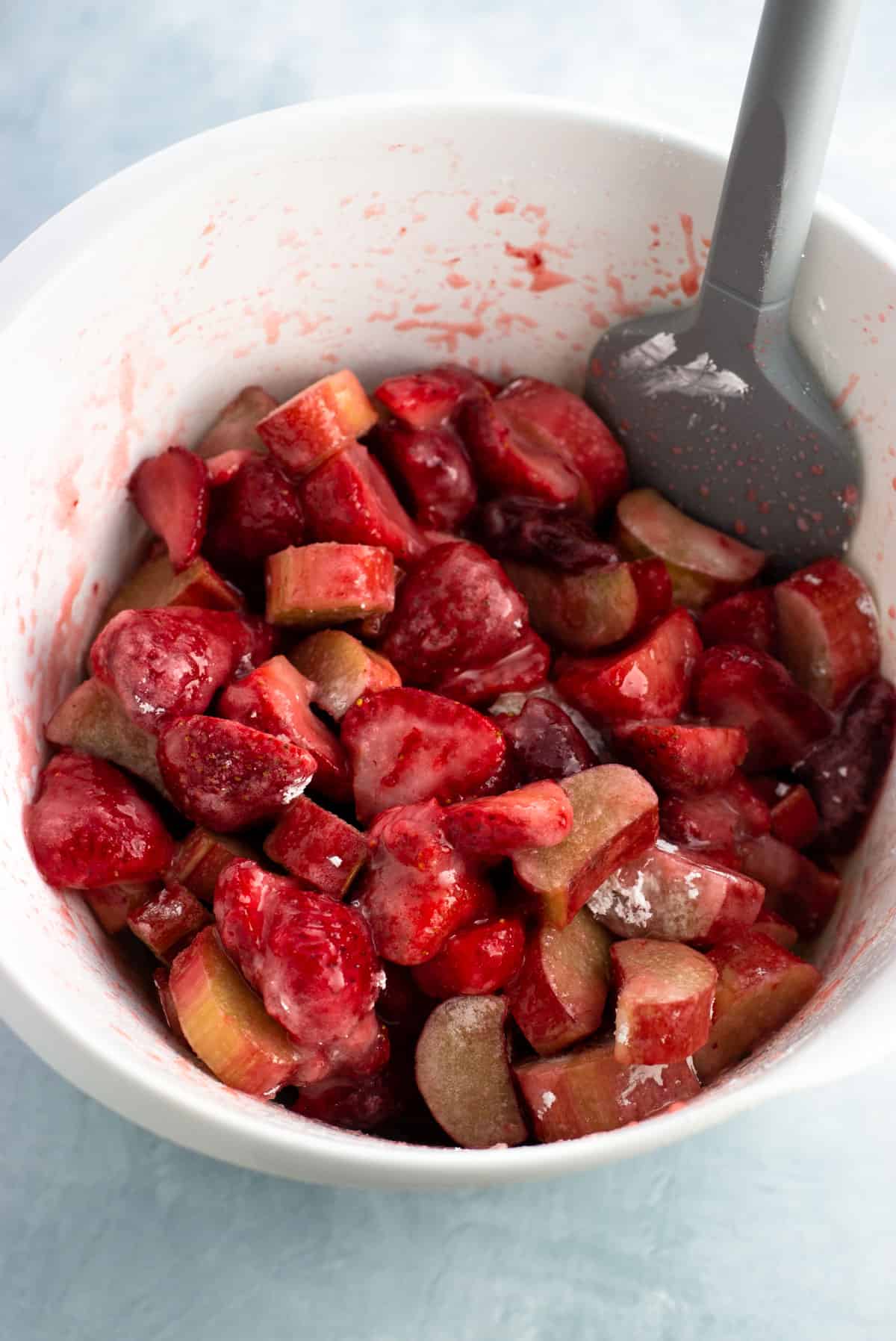 Fruit filling stirred together in a bowl.