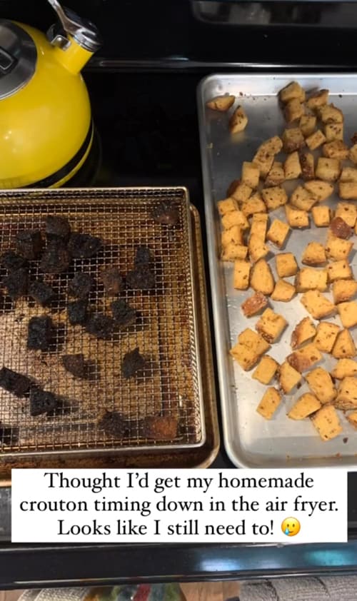 Burnt air fryer croutons next to baked croutons.