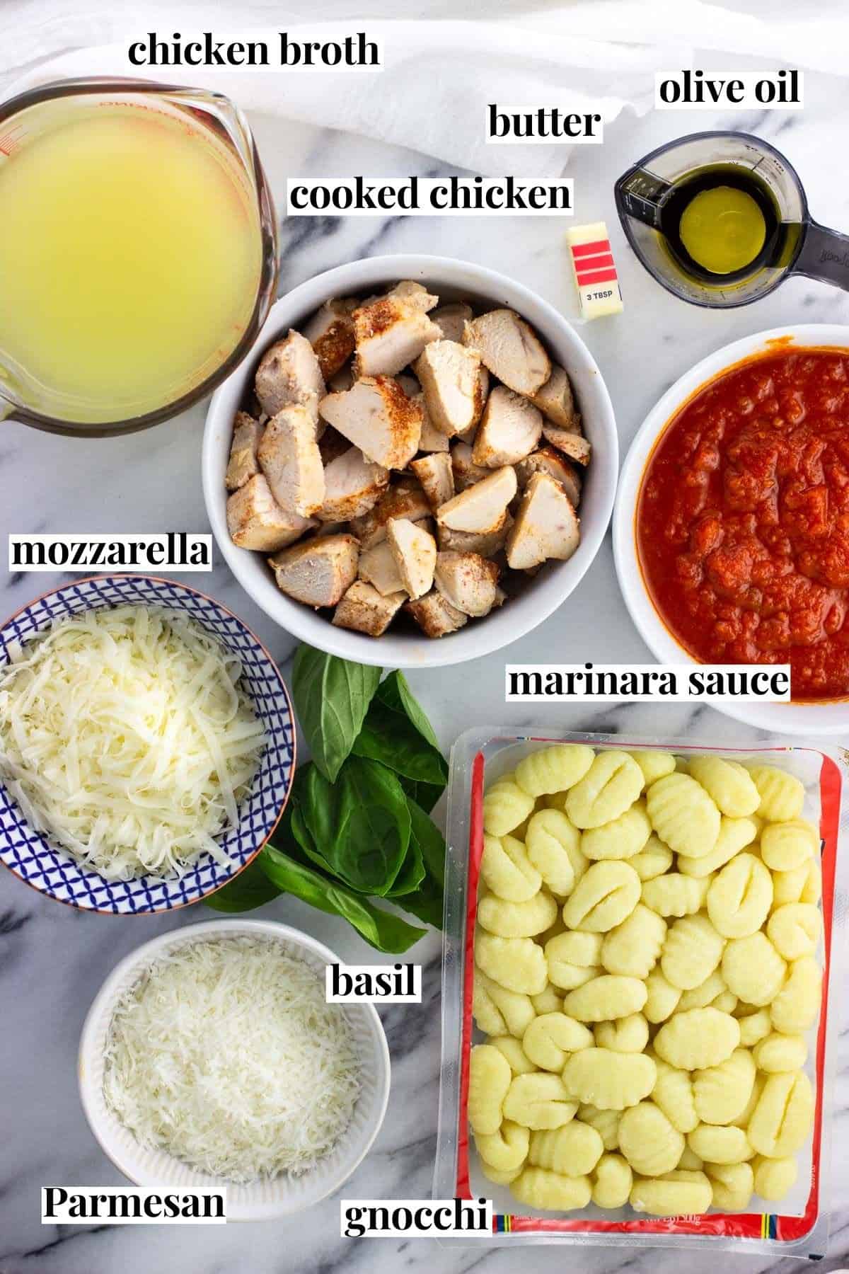 Labeled chicken Parmesan gnocchi skillet ingredients in separate containers.