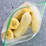 The frozen banana bag open to show the frost on each half.