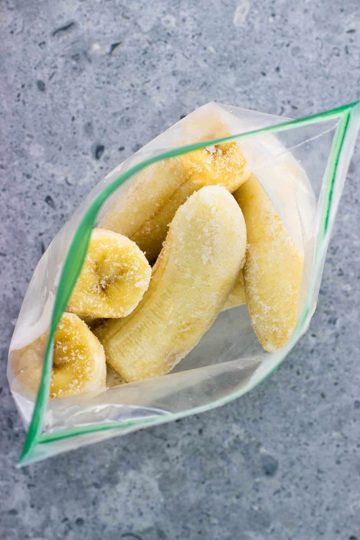 The frozen banana bag open to show the frost on each half.