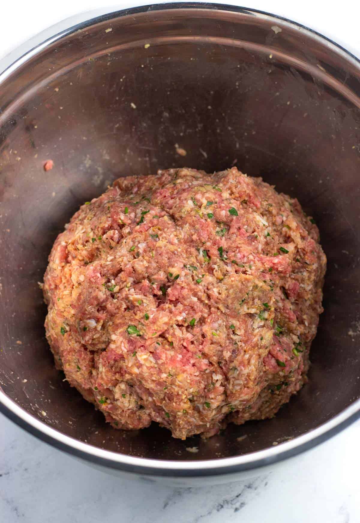 The meat mixture in a bowl all combined.