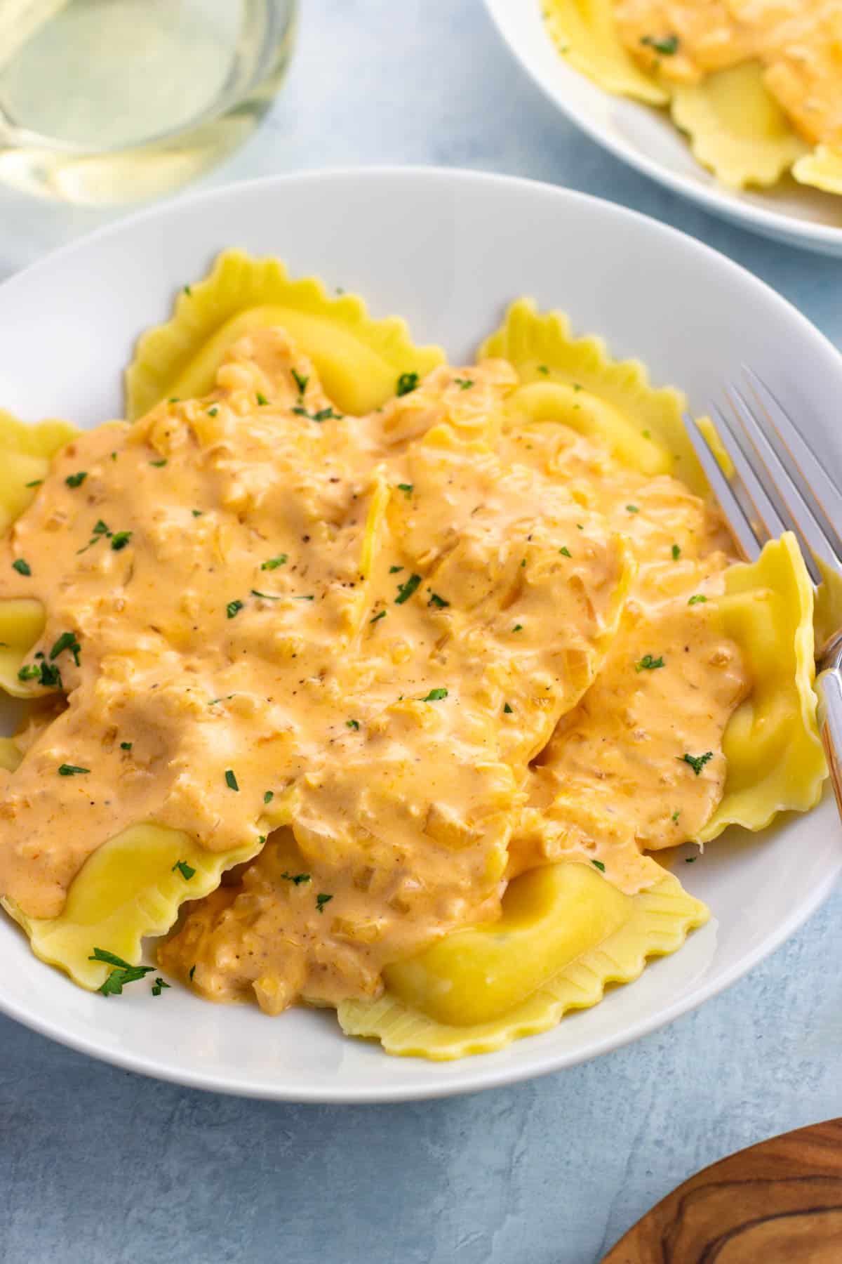 Lobster ravioli topped with a tomato cream sauce.