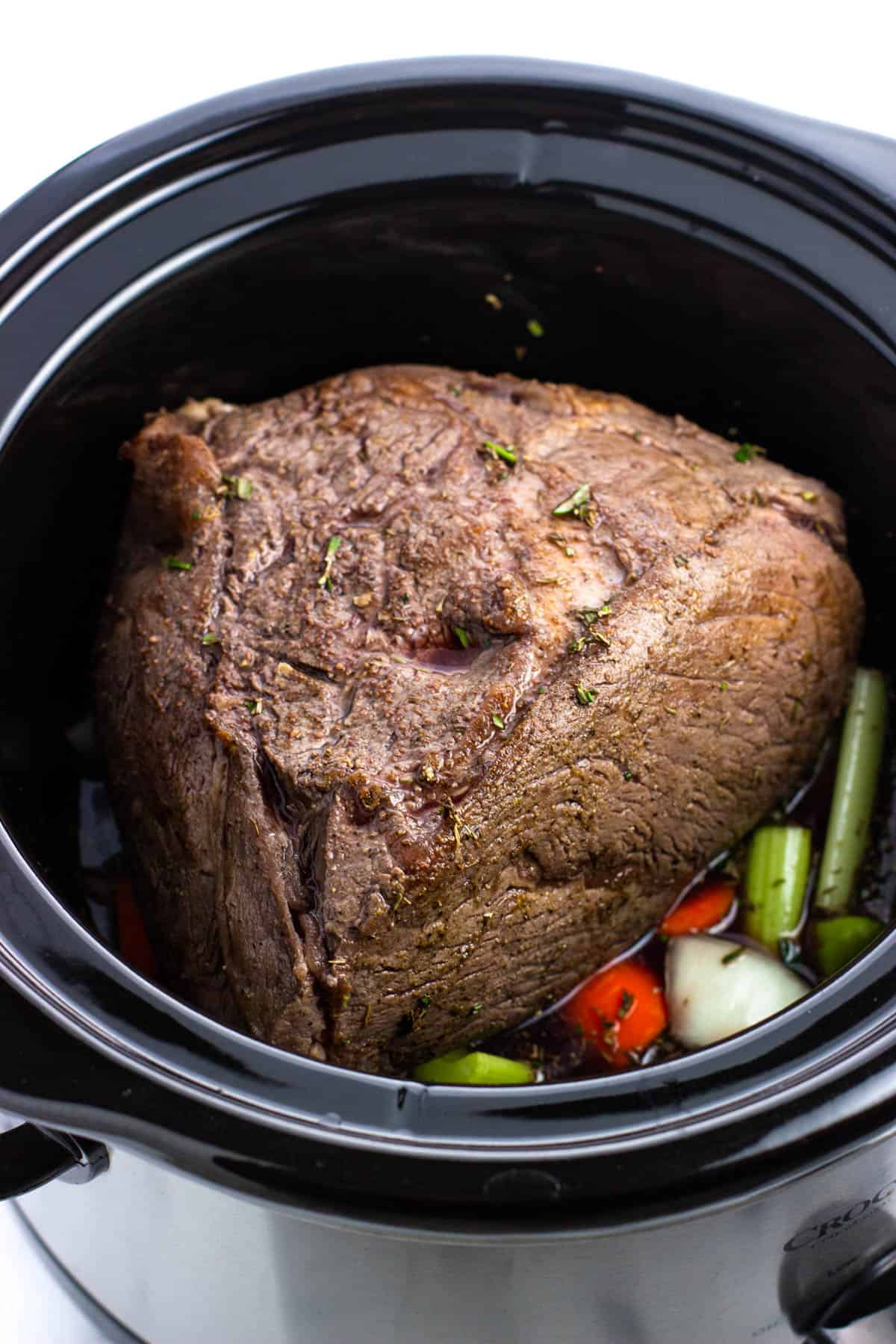 All ingredients poured into the slow cooker before cooking.