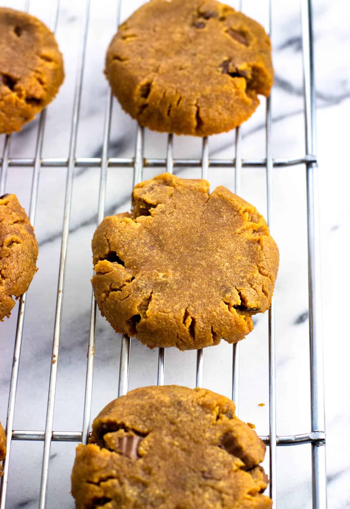 Cooling flourless peanut butter cookies on a wire rack.