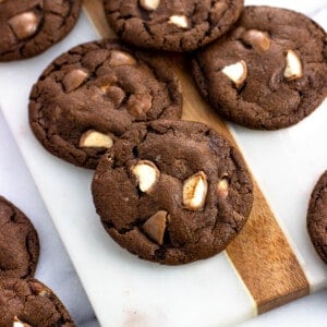 Several Whoppers cookies on a marble serving board.