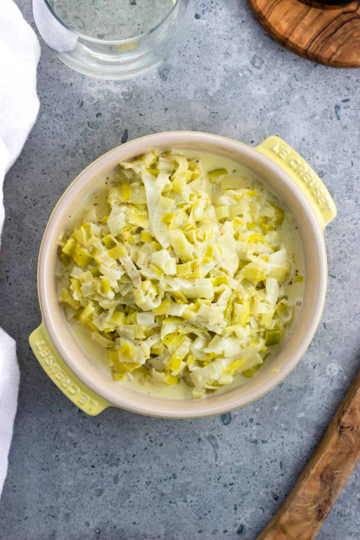 An overhead shot of a dish of creamed leeks.