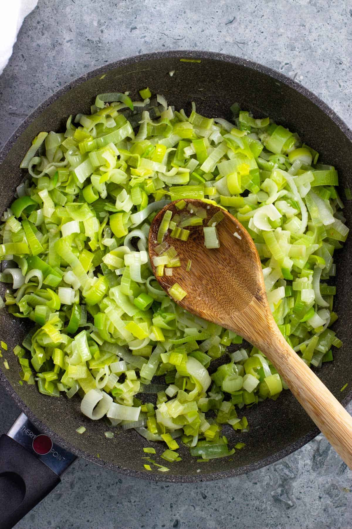 A pan of sauteed leeks and garlic in butter and olive oil.