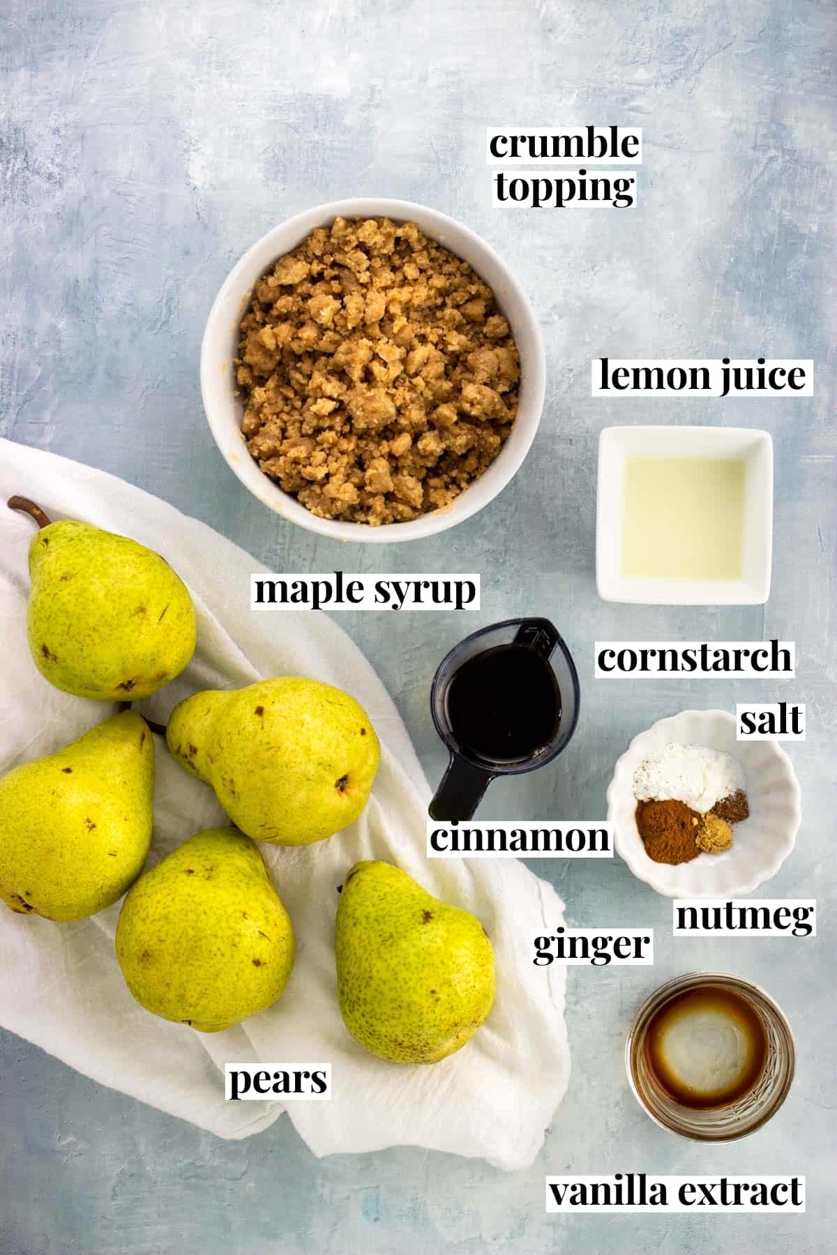 Labeled pear crumble ingredients in separate containers.