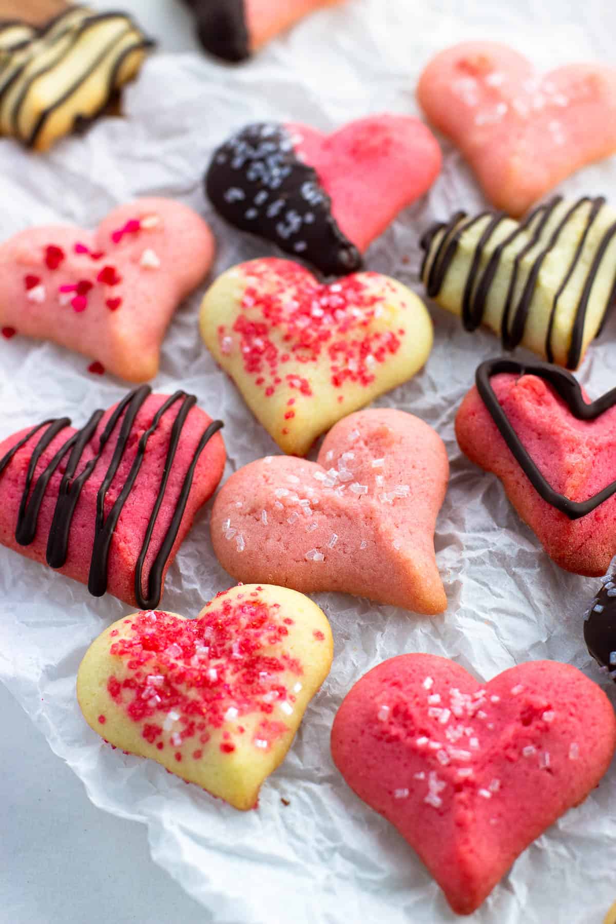 Valentine's Day spritz cookies decorated with chocolate and sprinkles.