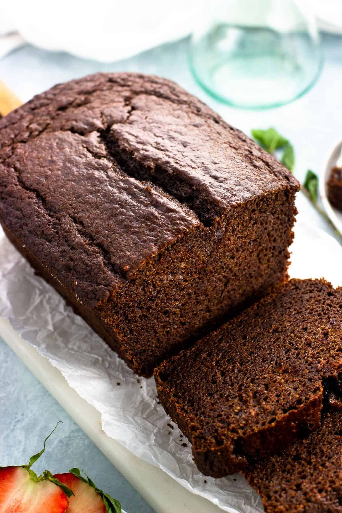 A loaf of chocolate yogurt cake sliced.