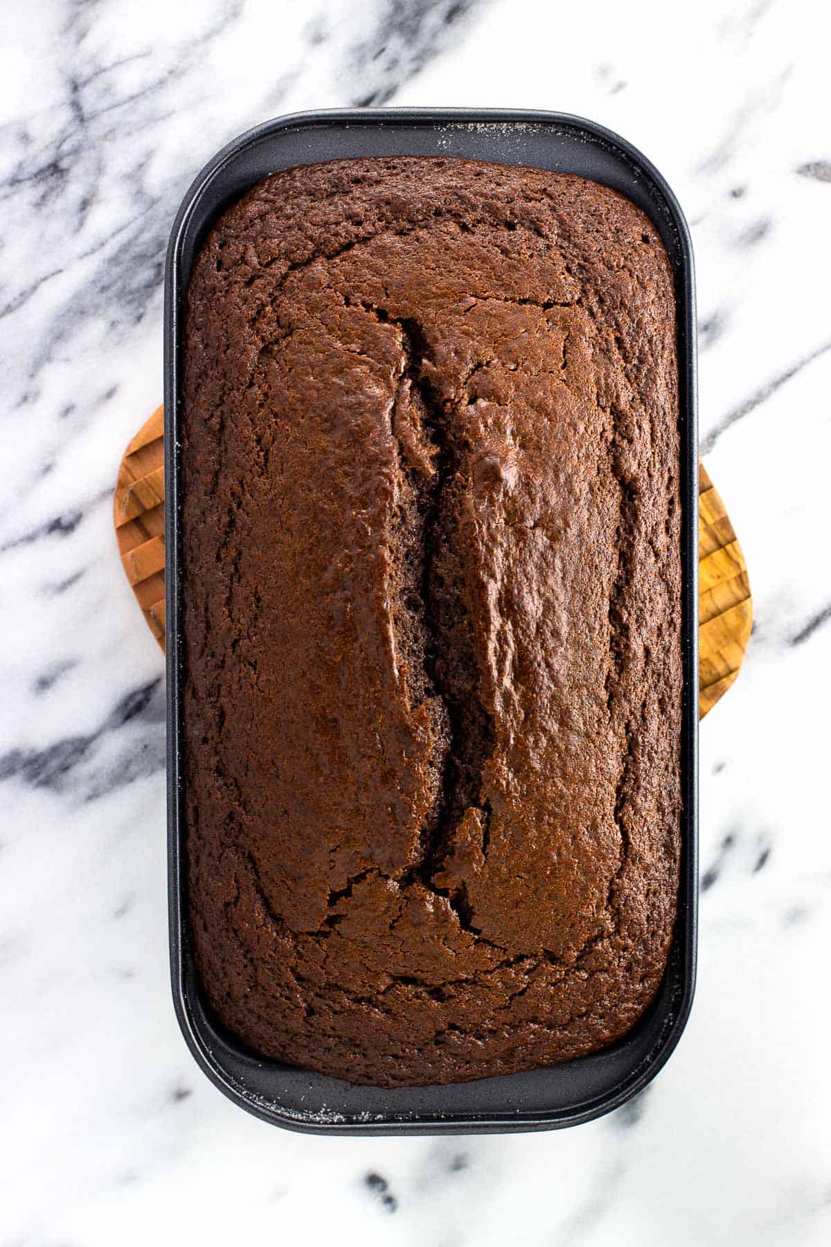 Baked chocolate cake in a loaf pan.