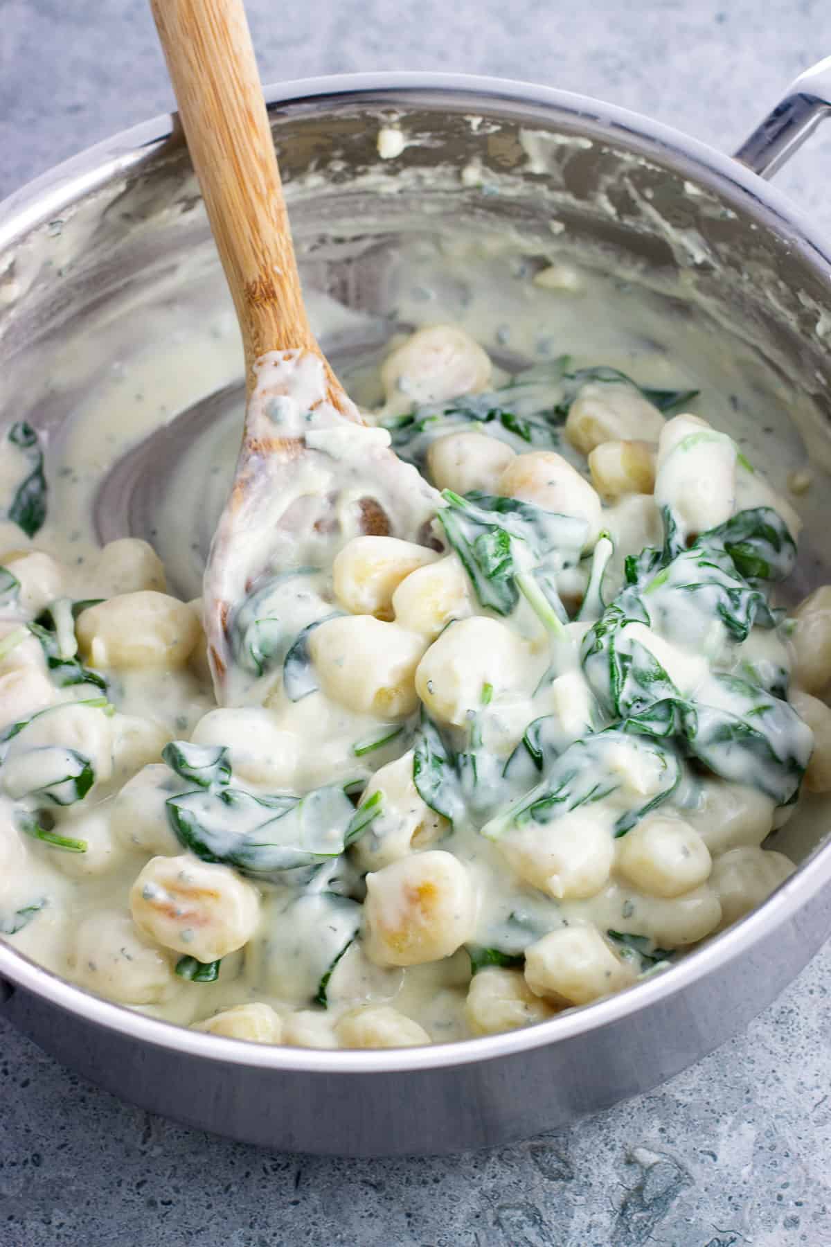 Creamy Gorgonzola gnocchi in a pan ready to serve.
