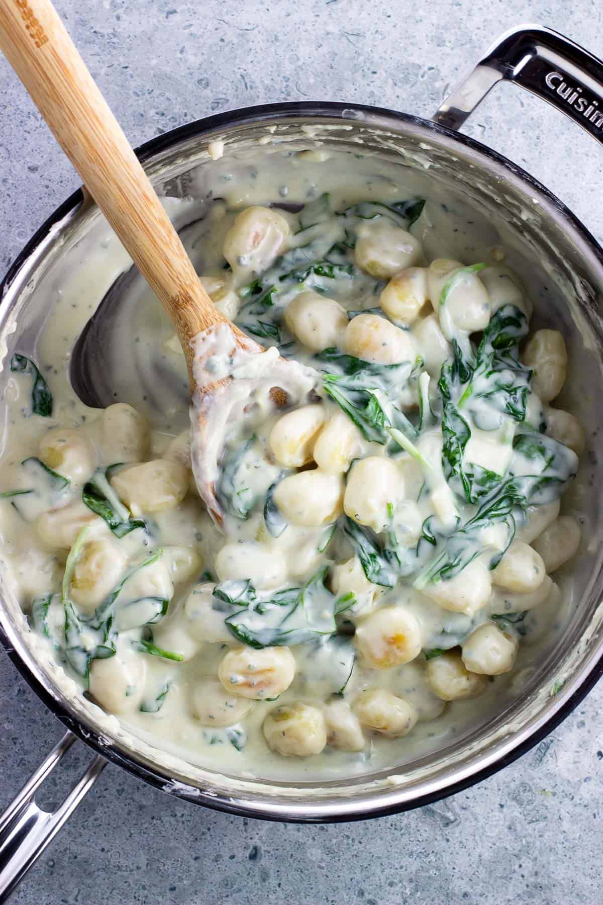 A pan of spinach and Gorgonzola gnocchi.