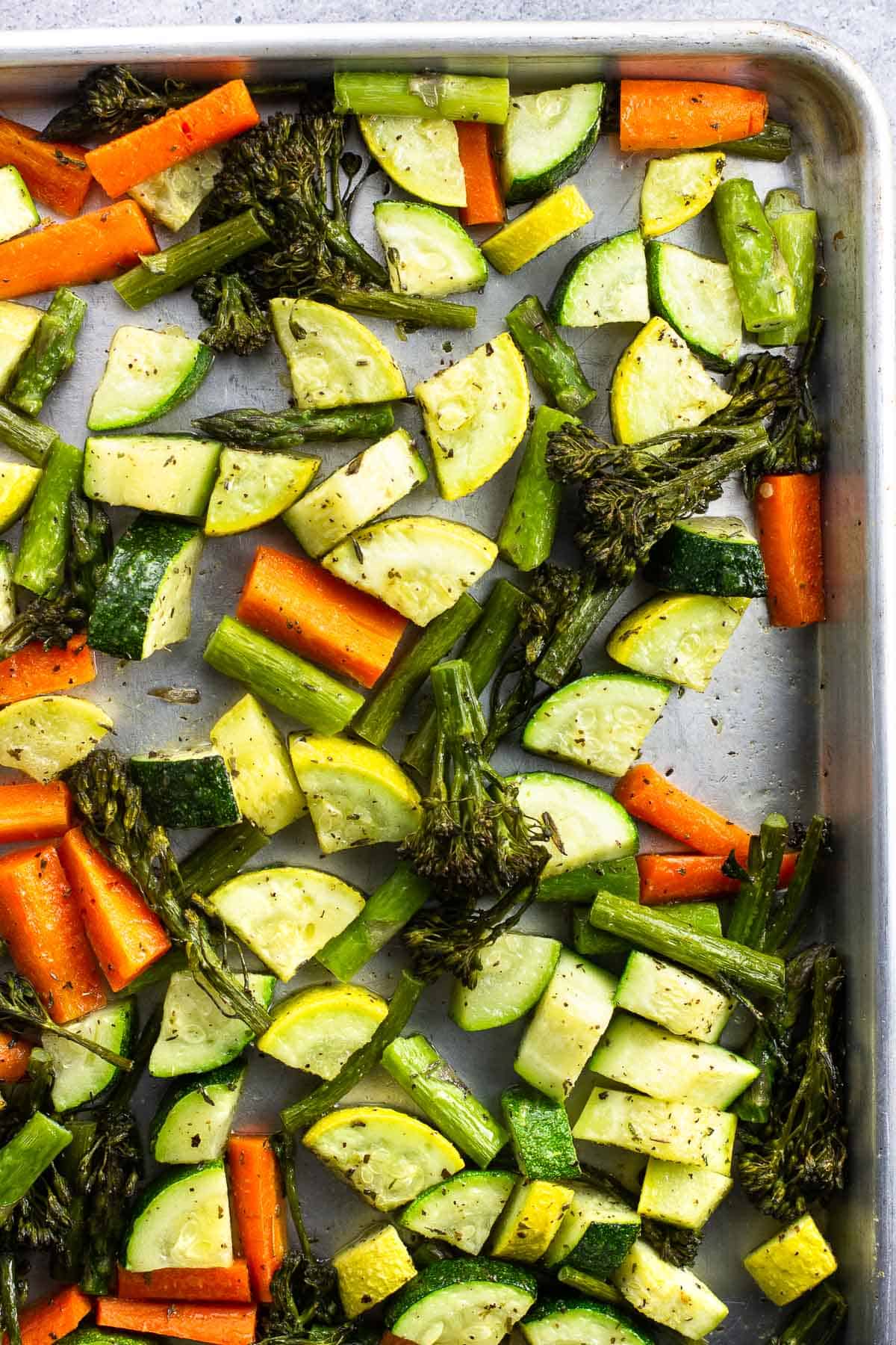 Roasted vegetables on a sheet pan.