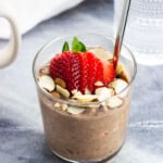 Protein overnight oats (chocolate) topped with sliced almonds and strawberries.