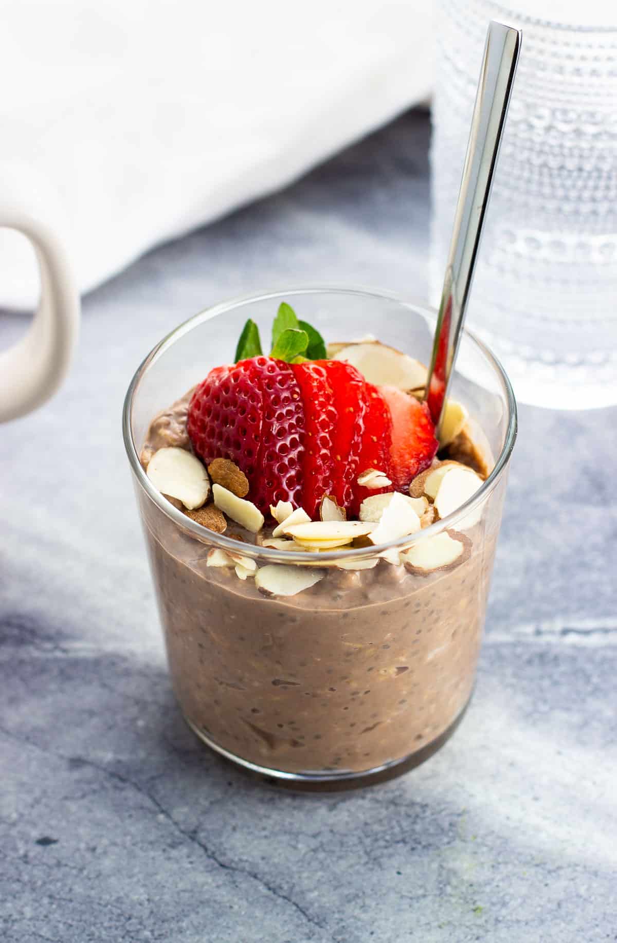 Protein overnight oats (chocolate) topped with sliced almonds and strawberries.