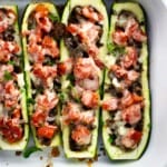 Taco zucchini boats in a baking dish ready to serve.