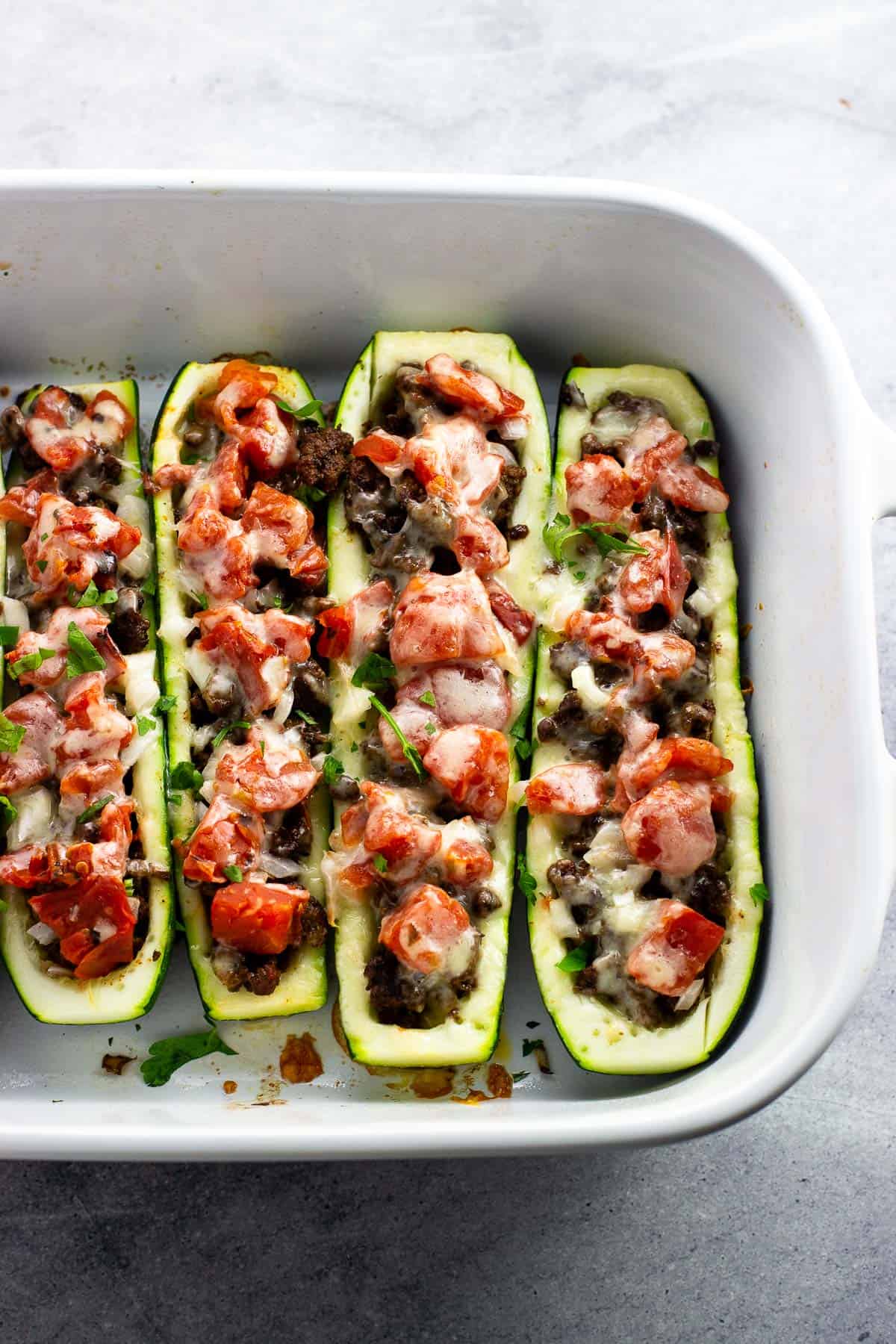 Taco zucchini boats in a baking dish ready to serve.