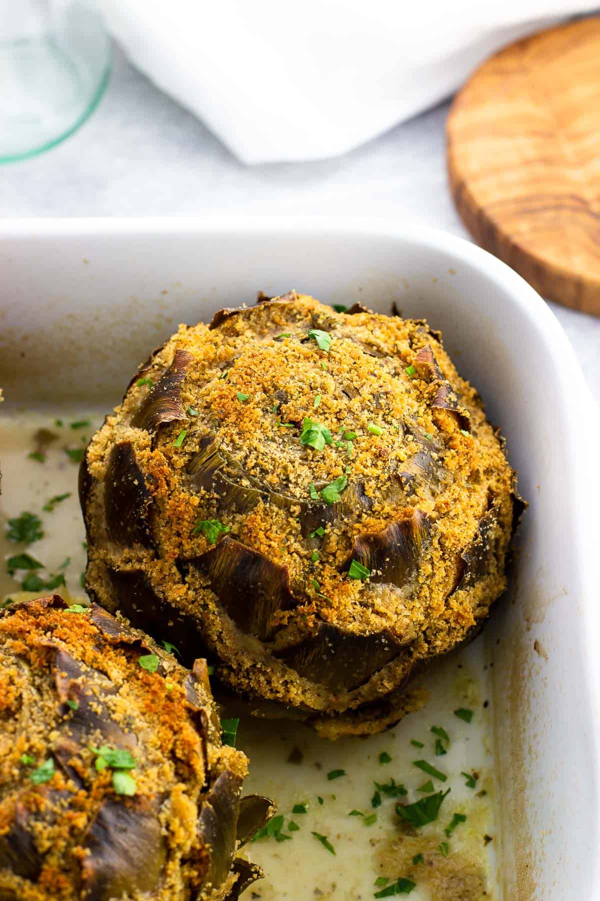 Italian stuffed artichokes in a pan.