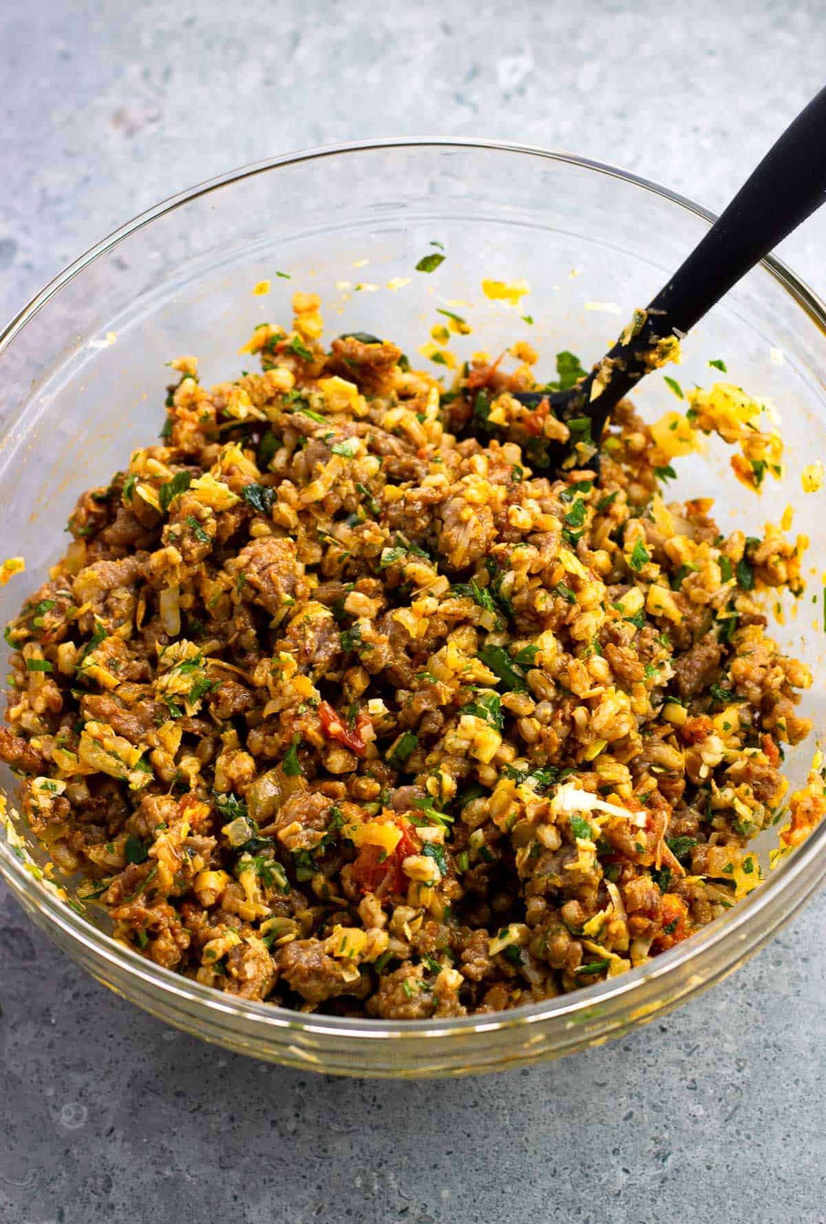 The farro and sausage filling mixed together in a bowl.