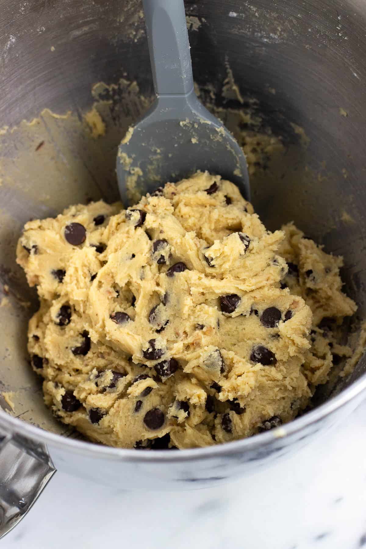 Bisquick chocolate chip cookie dough in a stand mixer bowl.