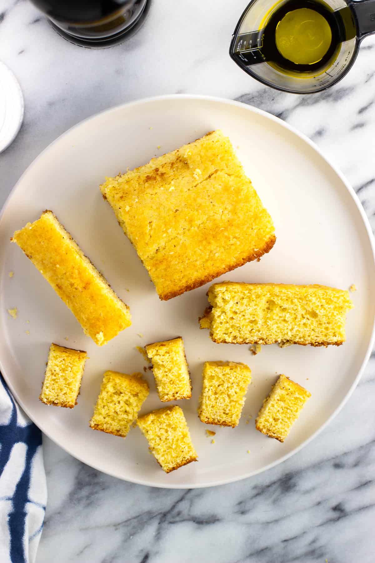 Leftover pieces of cornbread being sliced into cubes.